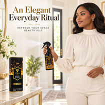 Woman in an ivory outfit holding Vilara Happy Scent room spray - an elegant everyday ritual